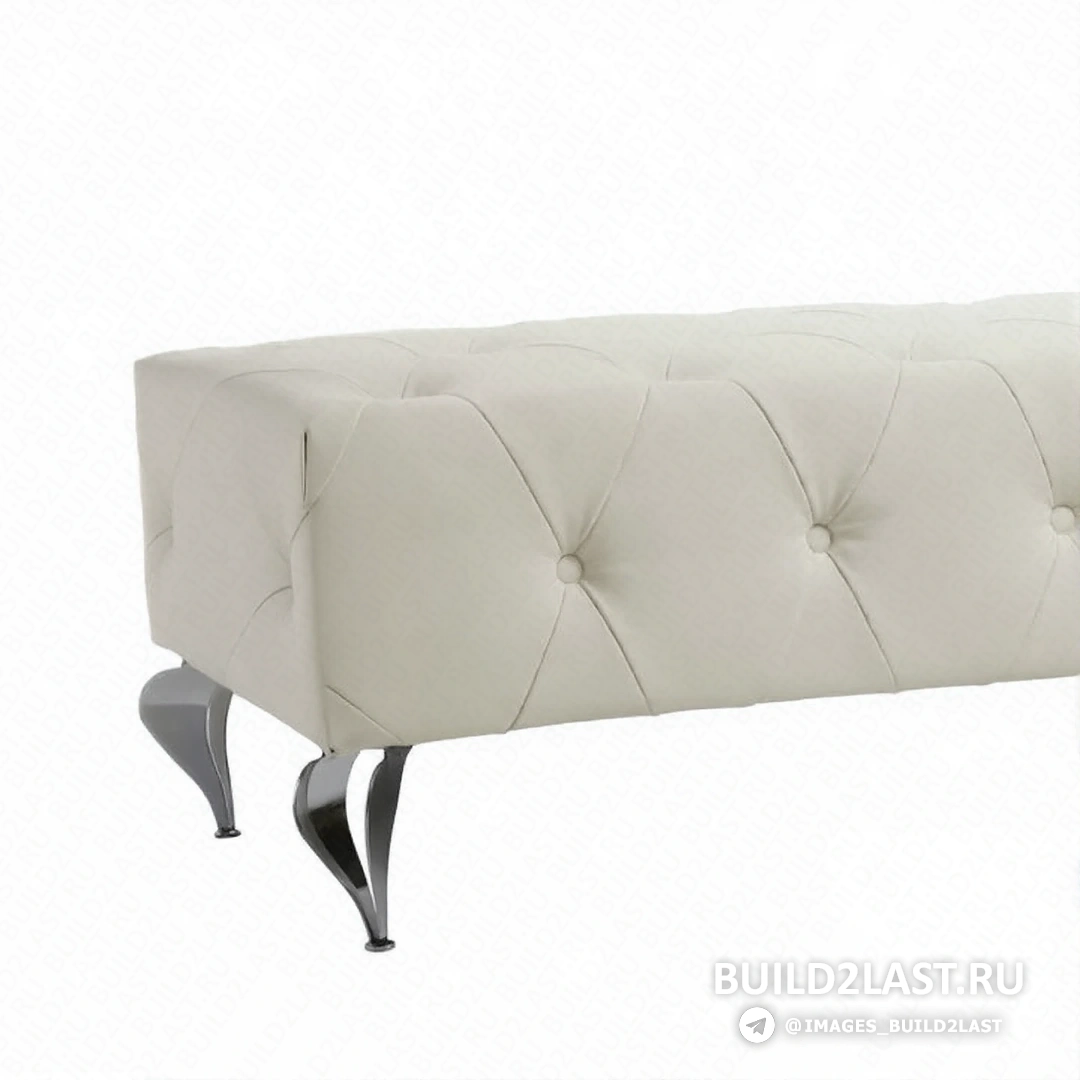 Гостиная с оттоманкой, светильниками и уютными текстильными деталями, оформленная в белых и серых тонах.